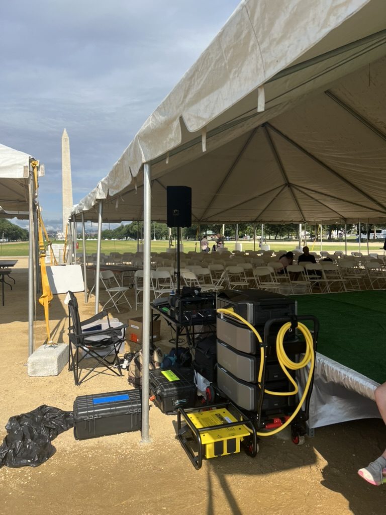 EcoFlow rig set up under an event tent with the Washington Monument in the background